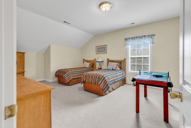 1729 Longleaf Dr, Myrtle Beach, SC 29575 - carpeted bedroom featuring vaulted ceiling, baseboards, and a textured ceiling