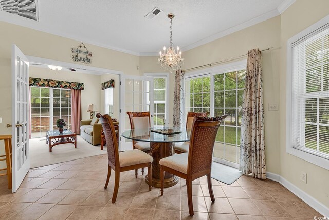 1729 Longleaf Dr, Myrtle Beach, SC 29575 - dining area with a chandelier, light tile patterned floors, crown molding, and plenty of natural light