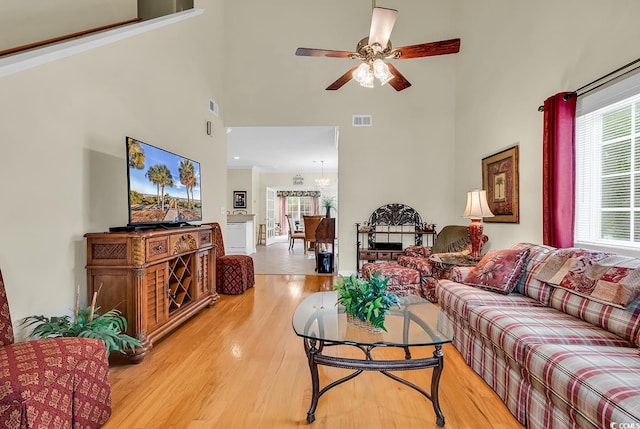 1729 Longleaf Dr, Myrtle Beach, SC 29575 - living room with a high ceiling, light wood finished floors, and a ceiling fan
