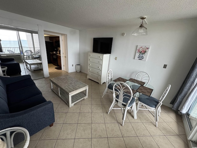 200 76th Ave N Unit 608, Myrtle Beach, SC 29572 - living room featuring light tile patterned floors and a textured ceiling