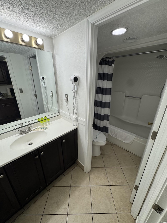 200 76th Ave N Unit 608, Myrtle Beach, SC 29572 - full bathroom featuring a textured ceiling, tile patterned flooring, vanity, shower / bath combo with shower curtain, and toilet