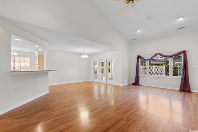 3107 Robyn Ct, Little River, SC 29566 - unfurnished living room with a chandelier, light wood finished floors, baseboards, a ceiling fan, and recessed lighting