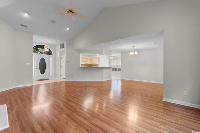 3107 Robyn Ct, Little River, SC 29566 - unfurnished living room featuring ceiling fan, a chandelier, high vaulted ceiling, light wood finished floors, and baseboards