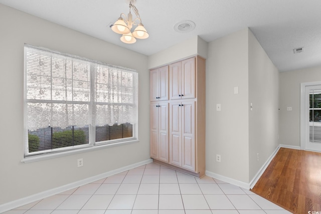 3107 Robyn Ct, Little River, SC 29566 - empty room featuring a chandelier and baseboards