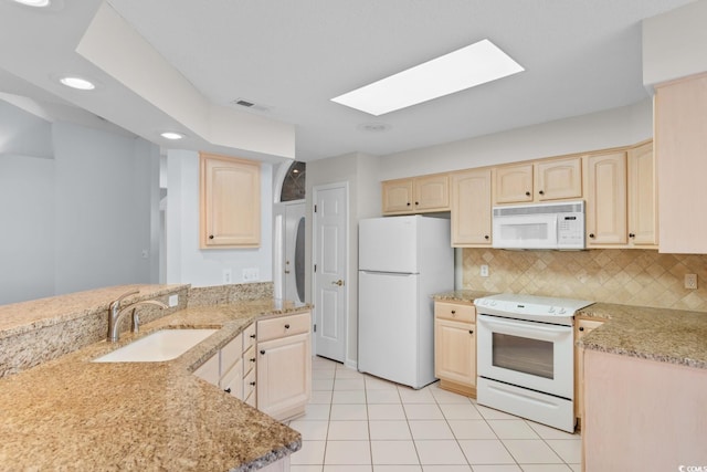 3107 Robyn Ct, Little River, SC 29566 - kitchen with white appliances, light brown cabinetry, a sink, and recessed lighting