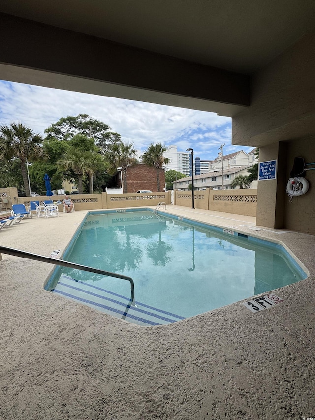7500 N Ocean Blvd Unit 6120, Myrtle Beach, SC 29572 - community pool featuring fence and a patio