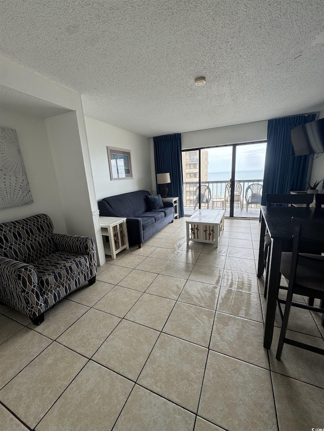 7500 N Ocean Blvd Unit 6120, Myrtle Beach, SC 29572 - living area with light tile patterned floors and a textured ceiling