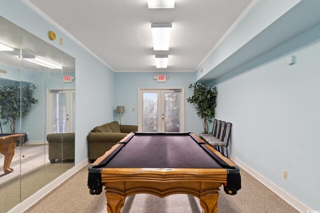 playroom featuring french doors, pool table, carpet flooring, crown molding, and baseboards