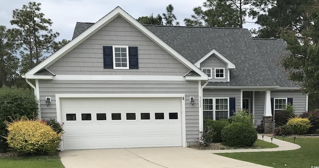 9232 Goodwill Ct, Myrtle Beach, SC 29579 - view of front facade with driveway, a shingled roof, and a garage