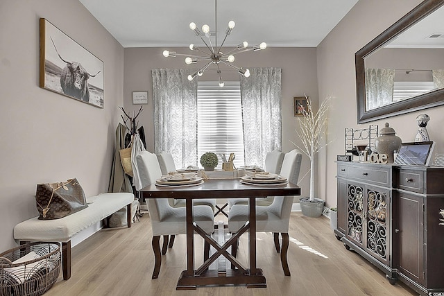 9232 Goodwill Ct, Myrtle Beach, SC 29579 - dining space with a chandelier, light wood-style flooring, and ornamental molding