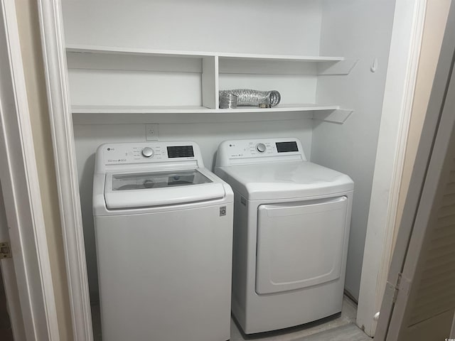 laundry area with independent washer and dryer