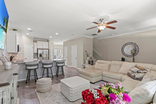 448 Papyrus Cir Unit 448, Little River, SC 29566 - living room featuring ceiling fan, ornamental molding, recessed lighting, wood finished floors, and baseboards