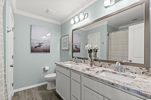 448 Papyrus Cir Unit 448, Little River, SC 29566 - bathroom with wood finished floors, baseboards, toilet, double vanity, and crown molding