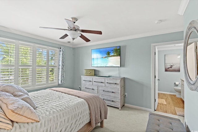 448 Papyrus Cir Unit 448, Little River, SC 29566 - bedroom featuring ornamental molding, baseboards, ceiling fan, and connected bathroom