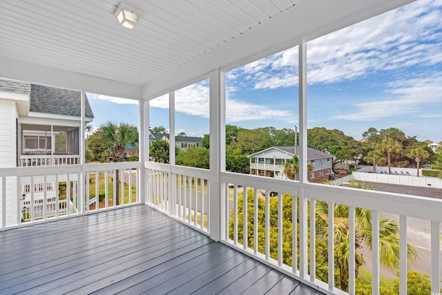 wooden terrace with a sunroom