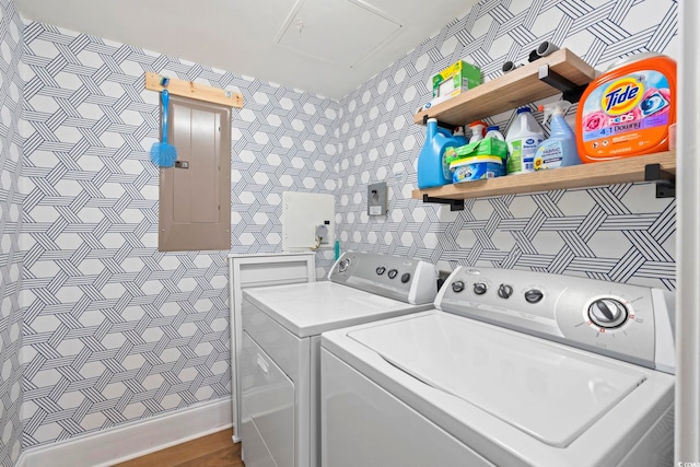 laundry area with washer and clothes dryer and electric panel