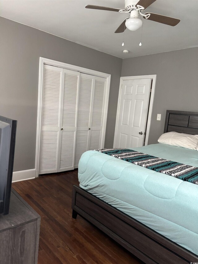 307 Pressley Ave, Kingstree, SC 29556 - bedroom featuring a closet, dark wood-style floors, a ceiling fan, and baseboards