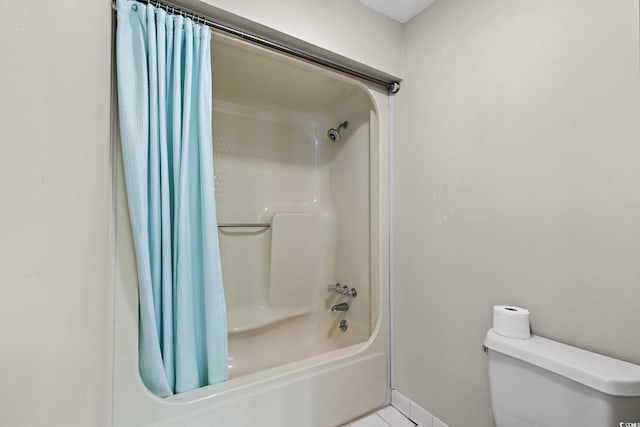 1314 Holly Dr, North Myrtle Beach, SC 29582 - full bath with shower / bath combo, toilet, tile patterned floors, and baseboards