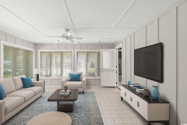 1314 Holly Dr, North Myrtle Beach, SC 29582 - living area with light tile patterned floors, a ceiling fan, and a decorative wall