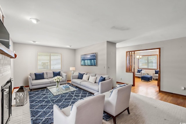 1314 Holly Dr, North Myrtle Beach, SC 29582 - living area with wood finished floors, baseboards, and a chandelier