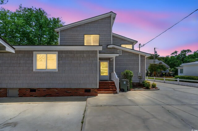 1314 Holly Dr, North Myrtle Beach, SC 29582 - view of front of house featuring crawl space, fence, and driveway