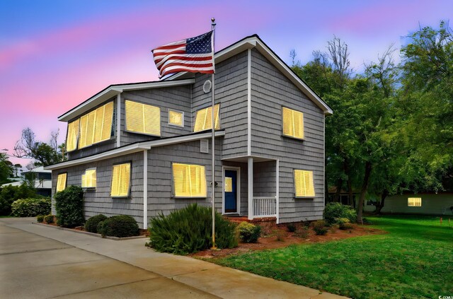 1314 Holly Dr, North Myrtle Beach, SC 29582 - view of front facade featuring a yard
