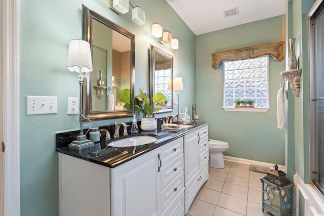 full bath featuring tile patterned flooring, toilet, vanity, baseboards, and a shower with door
