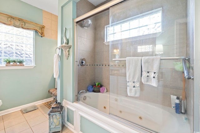 bathroom featuring tile patterned floors, baseboards, and a combined bath / shower with jetted tub