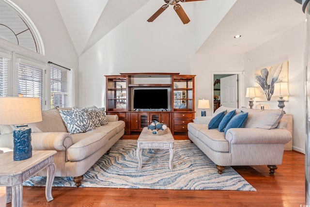 living room with a ceiling fan, vaulted ceiling, wood finished floors, and recessed lighting