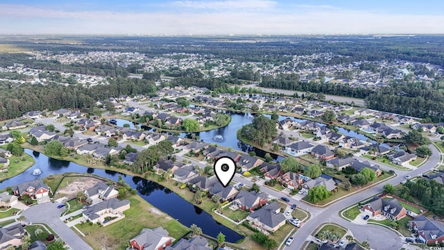 aerial overview of property's location with nearby suburban area and a large body of water