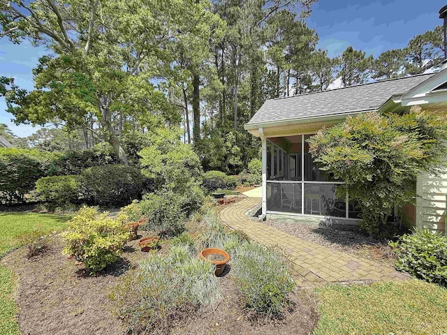 view of yard with a sunroom