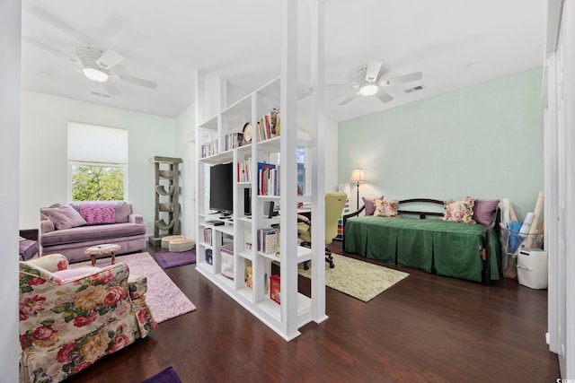 bedroom with wood finished floors and a ceiling fan