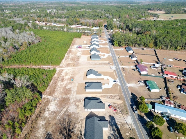 aerial view of property's location featuring a heavily wooded area