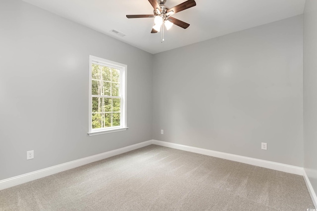 unfurnished room with baseboards, carpet, and ceiling fan