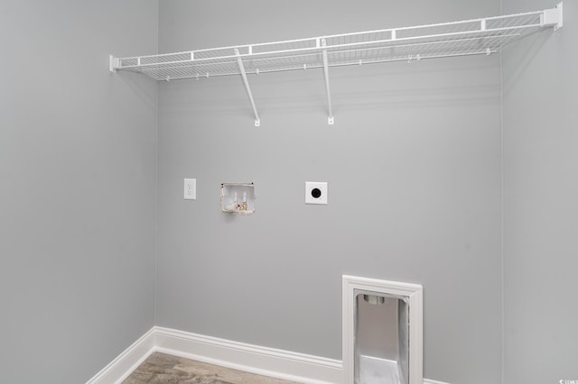 laundry area featuring hookup for an electric dryer, washer hookup, and baseboards