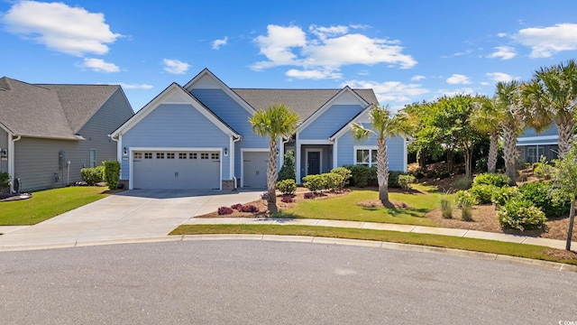 view of front of home featuring concrete driveway, a garage, and a front yard