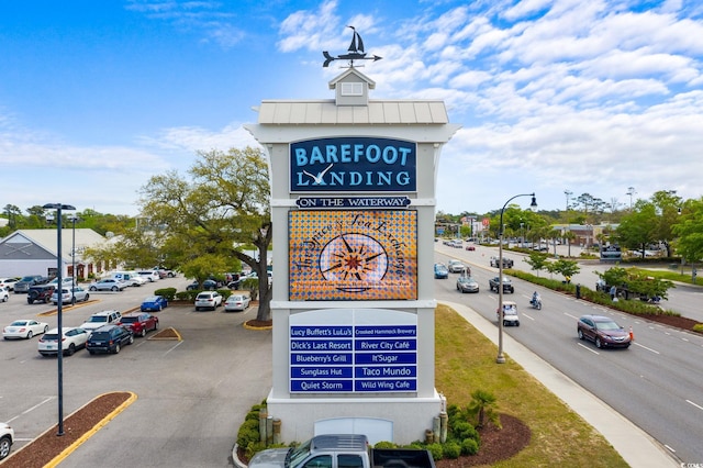 community sign with uncovered parking