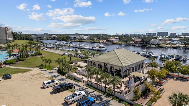 view of urban area with a marina and a large body of water