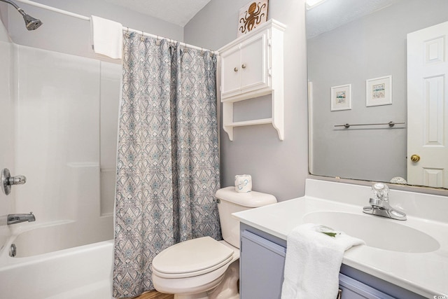 bathroom featuring toilet, shower / bath combo, and vanity