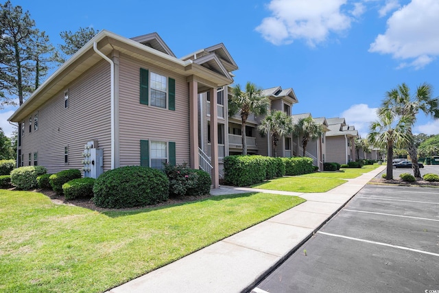 342 Pinehurst Ln Unit 12J, Pawleys Island, SC 29585 - view of home's exterior with uncovered parking and a yard