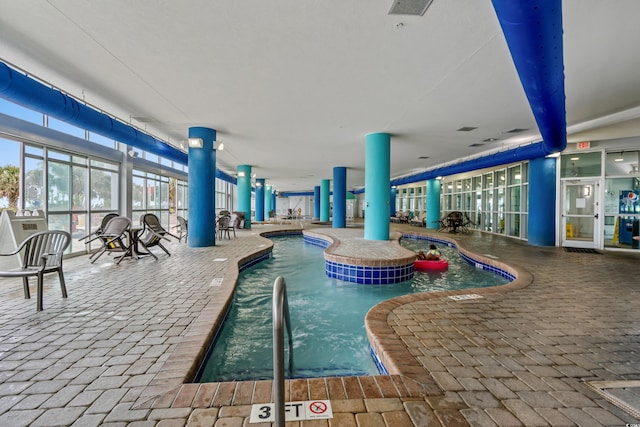 504 N Ocean Blvd N Unit 309, Myrtle Beach, SC 29577 - indoor community pool with a patio area and an in-ground hot tub