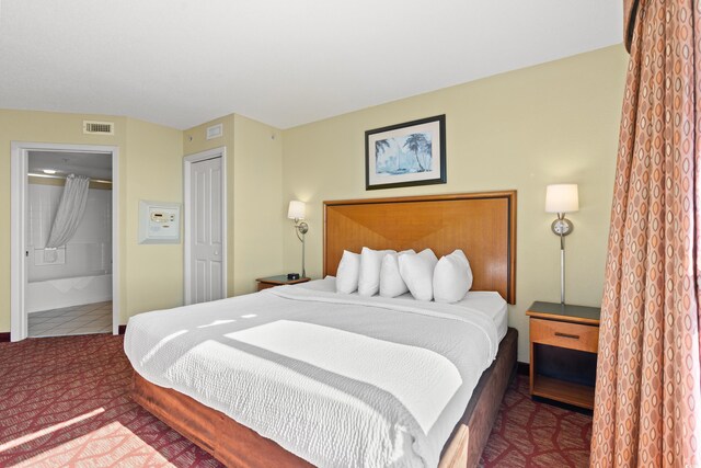 504 N Ocean Blvd N Unit 309, Myrtle Beach, SC 29577 - bedroom featuring carpet and connected bathroom