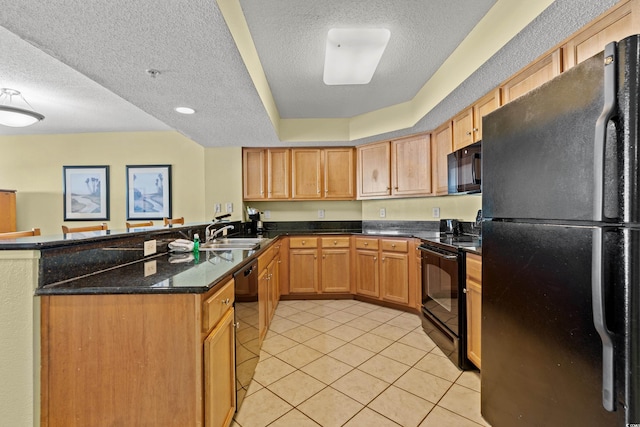 504 N Ocean Blvd N Unit 309, Myrtle Beach, SC 29577 - kitchen with black appliances, a sink, a textured ceiling, light tile patterned floors, and a peninsula