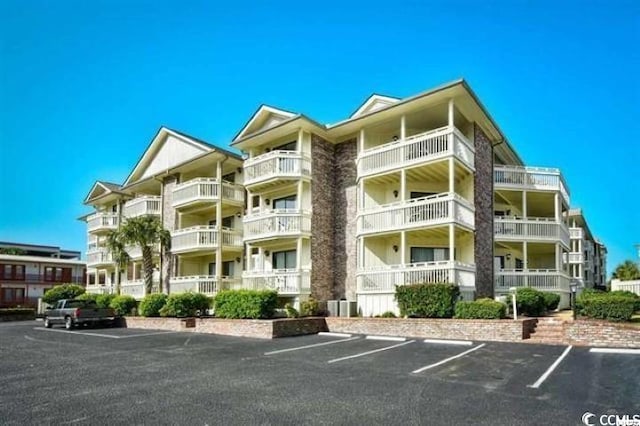 2805 N Ocean Blvd Unit 113, Myrtle Beach, SC 29577 - view of apartment building / complex with uncovered parking