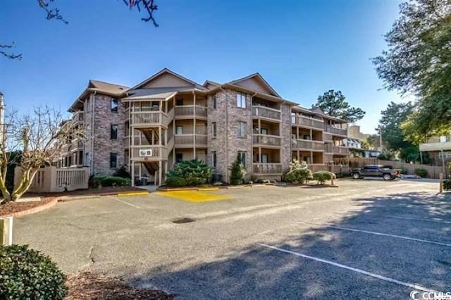 2805 N Ocean Blvd Unit 113, Myrtle Beach, SC 29577 - view of apartment building / complex featuring uncovered parking