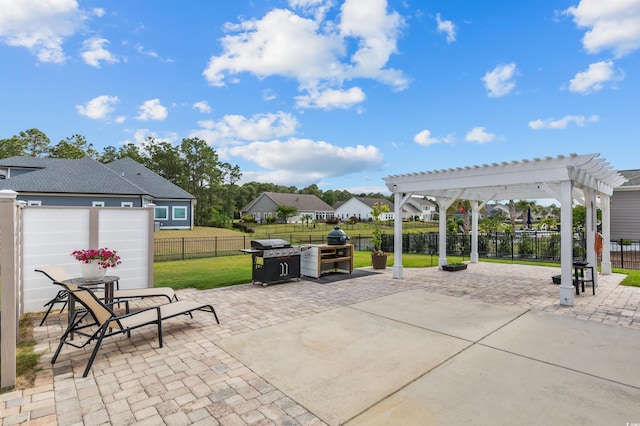 view of patio with a pergola, grilling area, and a residential view