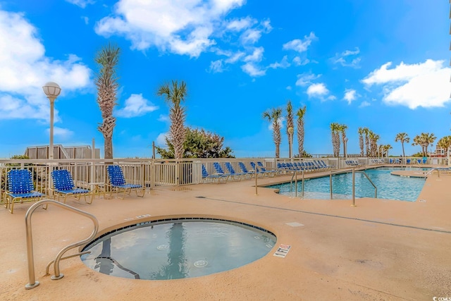 community pool featuring a patio