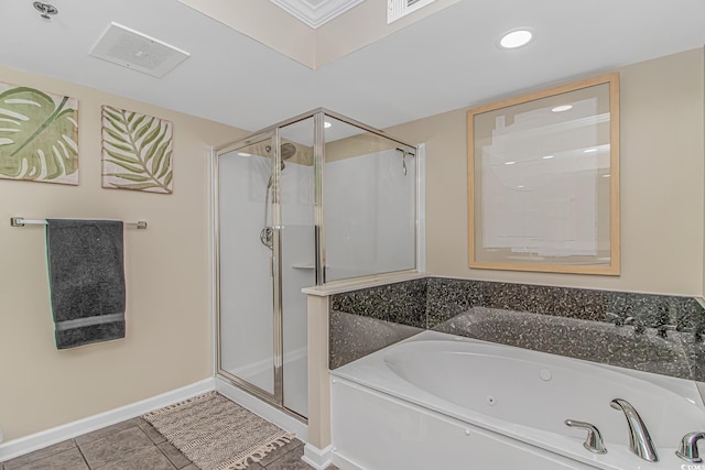 full bathroom with a shower stall, a tub with jets, tile patterned flooring, baseboards, and recessed lighting