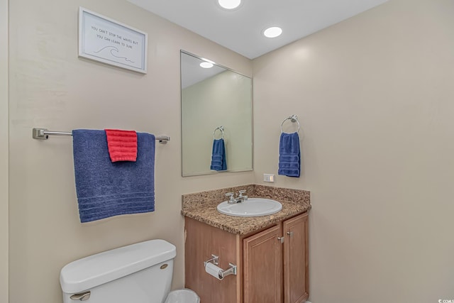 half bath with toilet and vanity
