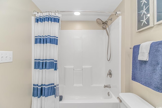 full bathroom with shower / tub combo with curtain and toilet